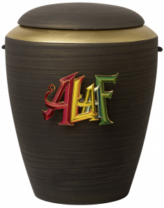 Handgefertigte, schwarze Urne mit einem bunten Schriftzug vom Narrenruf „ALAAF" von Bestattungen Hampel in Poll
